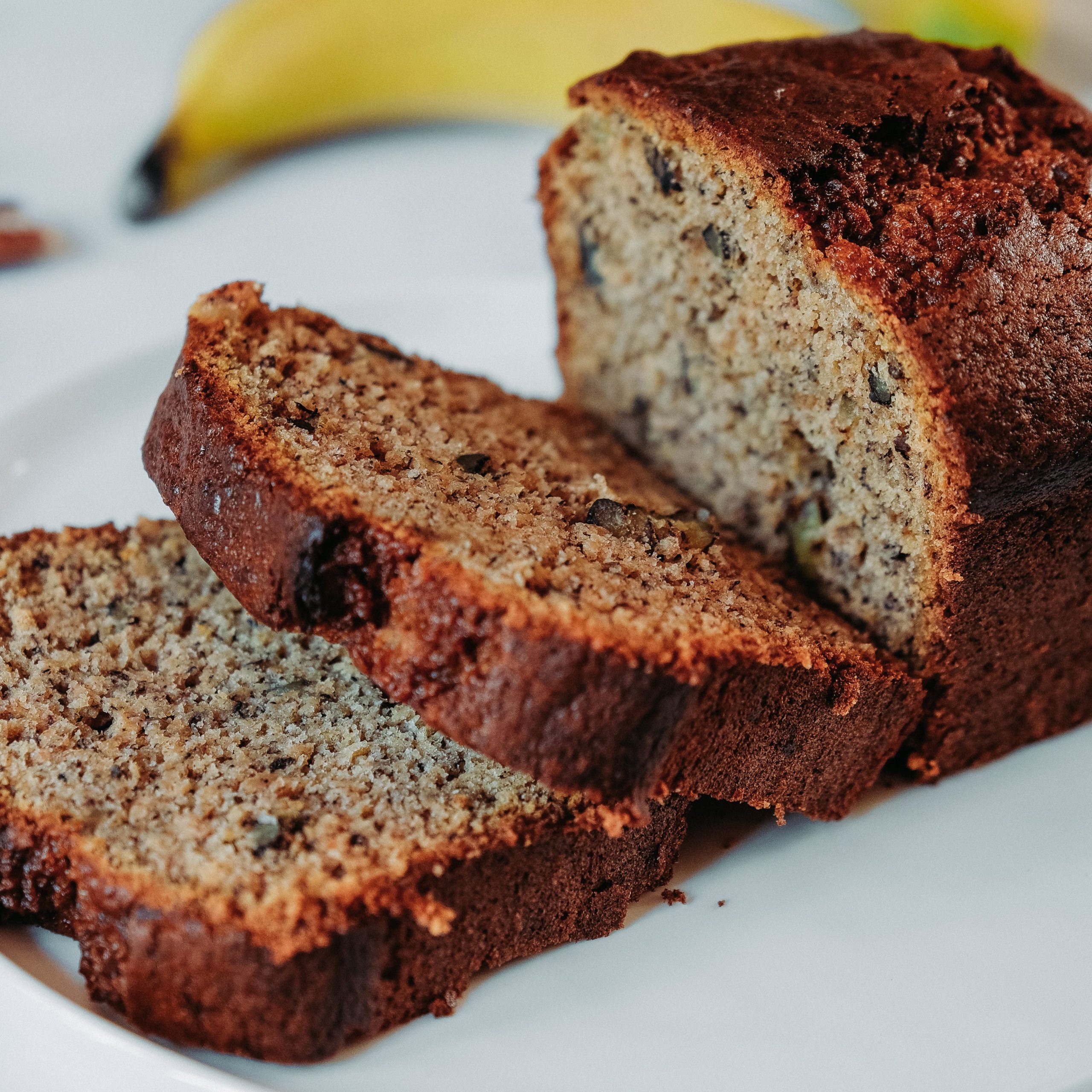 sliced banana bread on white plate made with campbell grains khorasan wheat